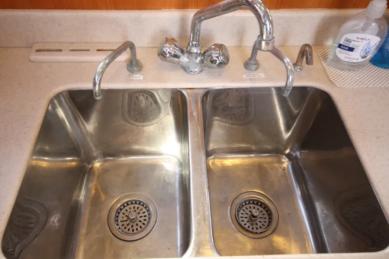 Slide: The Image of Stainless steel double sink with faucets on a 2001 Outbound 44/46 yacht. - 16