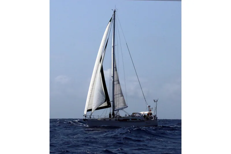 Slide: The Image of Sailing yacht Outbound 44/46 from 2001 navigating open sea under clear skies. - 56