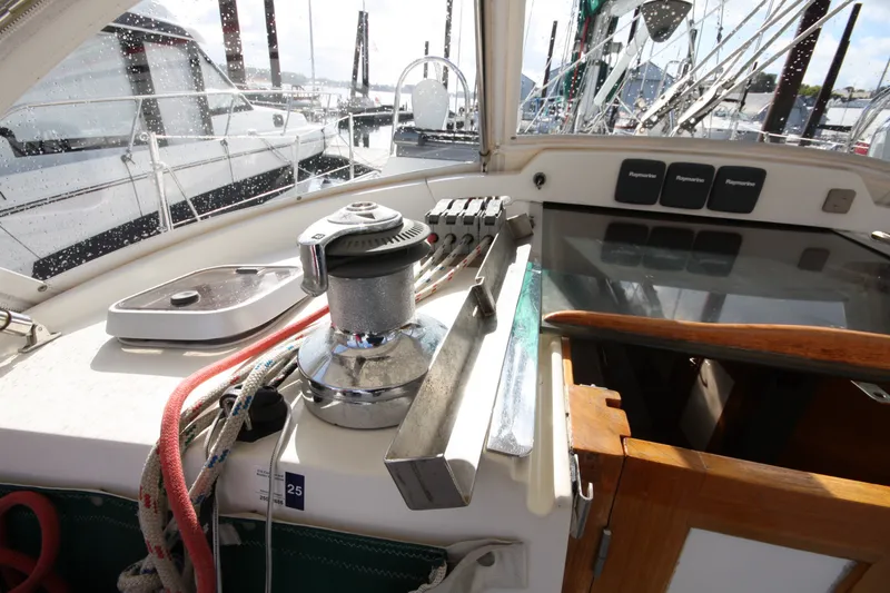 Slide: The Image of Cockpit view of a 2001 Outbound 44/46 sailboat with winch and ropes. - 47