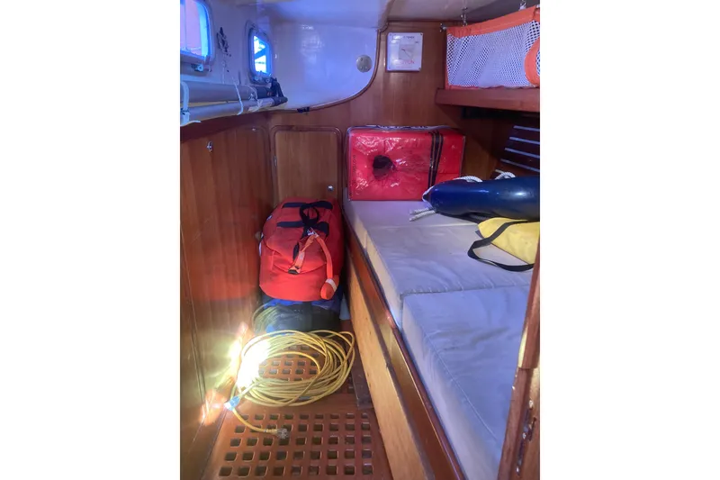 Slide: The Image of Cozy cabin interior of 2001 Outbound 44/46 sailboat with storage and equipment. - 29