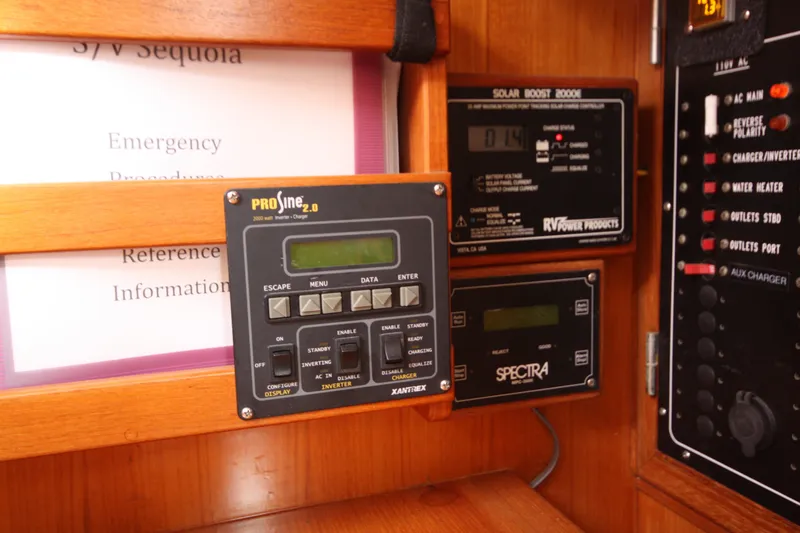 Slide: The Image of Control panel of a 2001 Outbound 44/46 yacht with ProSine inverter and Spectra watermaker. - 13