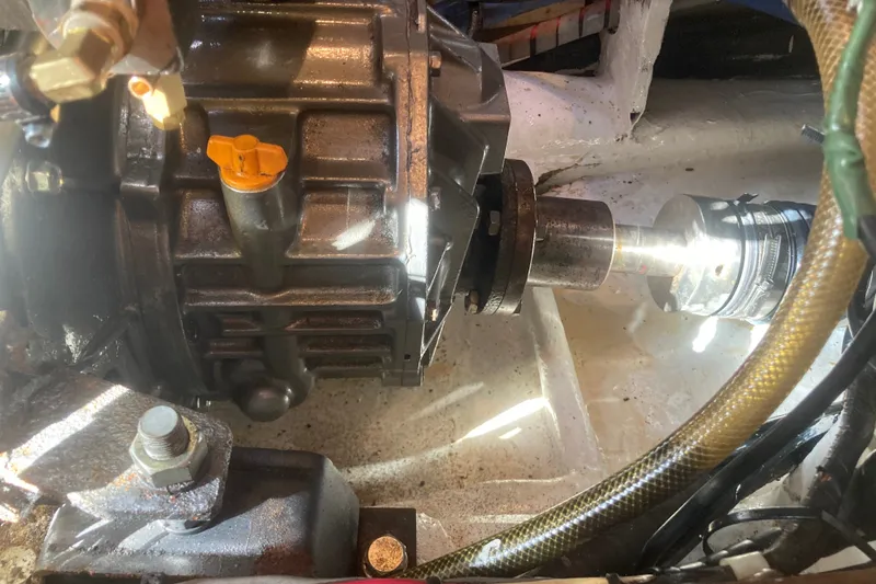 Slide: The Image of Engine component of a 2001 Outbound 44/46 boat, featuring mechanical details and connections. - 33