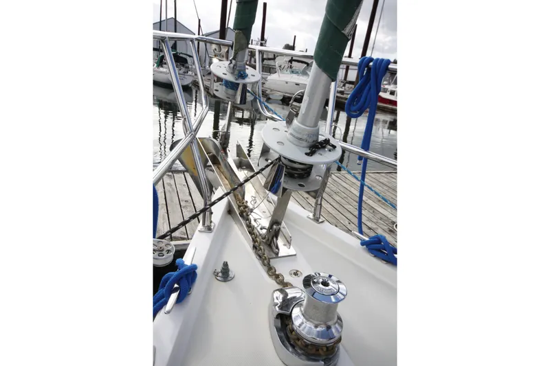 Slide: The Image of Deck view of a 2001 Outbound 44/46 sailboat with anchor chain and winch. - 5