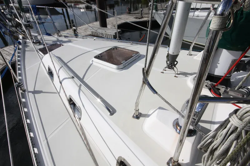 Slide: The Image of Sailboat deck of 2001 Outbound 44/46, featuring sleek design and polished fittings. - 44