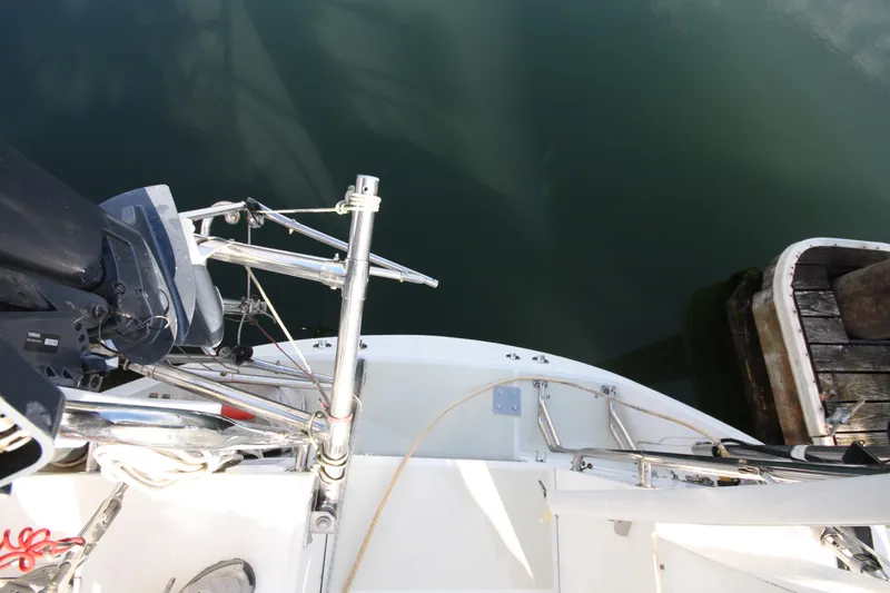 Slide: The Image of Top view of 2001 Outbound 44/46 yacht stern, docked beside wooden pier. - 46