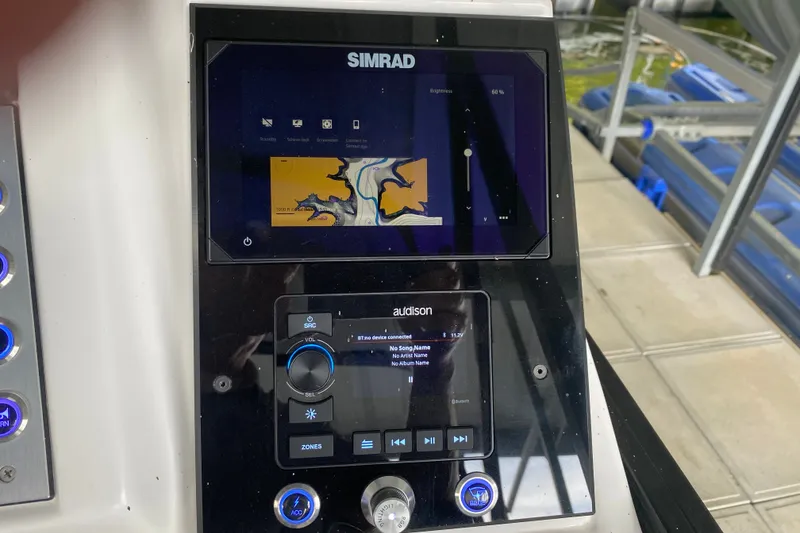 Slide: The Image of Simrad display on 2024 Barletta Corsa 25U boat, showing audio controls and navigation. - 20