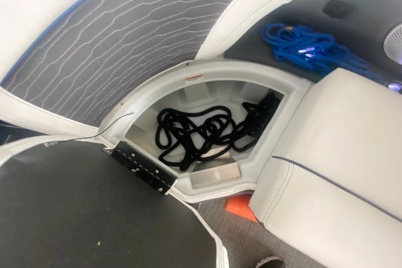 Slide: The Image of 2024 Barletta Corsa 25U boat storage compartment with ropes and accessories. - 40