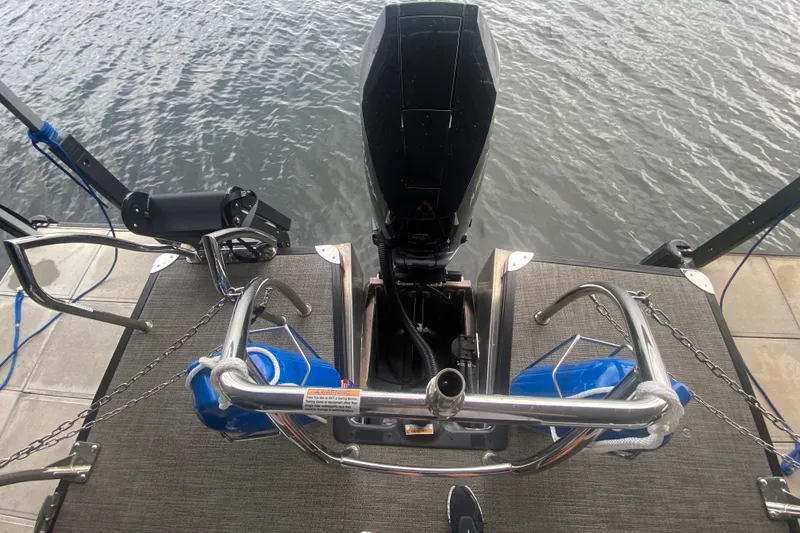 Slide: The Image of 2024 Barletta Corsa 25U boat engine and deck view by the water. - 9