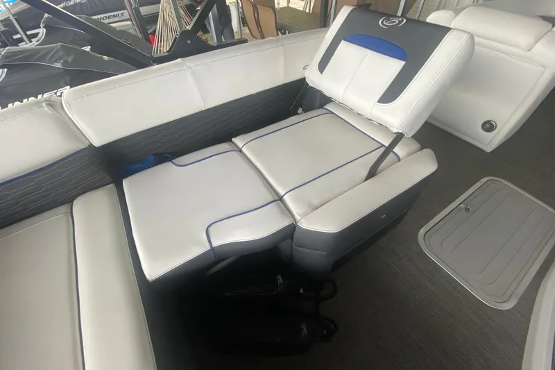 Slide: The Image of 2024 Barletta Corsa 25U boat interior with luxurious white seating and blue accents. - 36