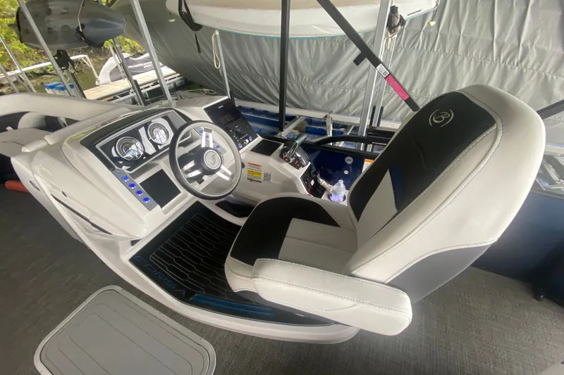 Slide: The Image of 2024 Barletta Corsa 25U boat cockpit with modern steering and control panel. - 28