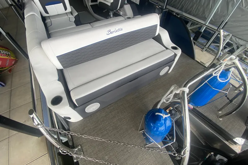 Slide: The Image of 2024 Barletta Corsa 25U boat interior with plush seating and modern design. - 8