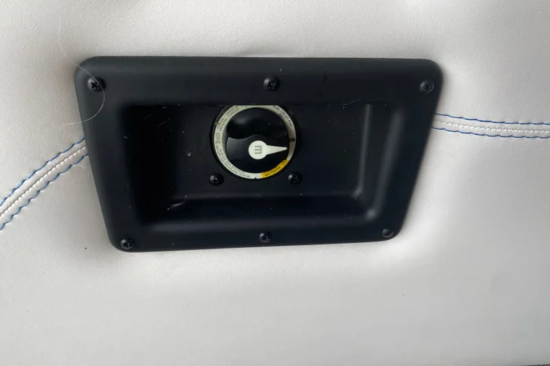 Slide: The Image of Control panel on 2024 Barletta Corsa 25U boat with white upholstery and blue stitching. - 44