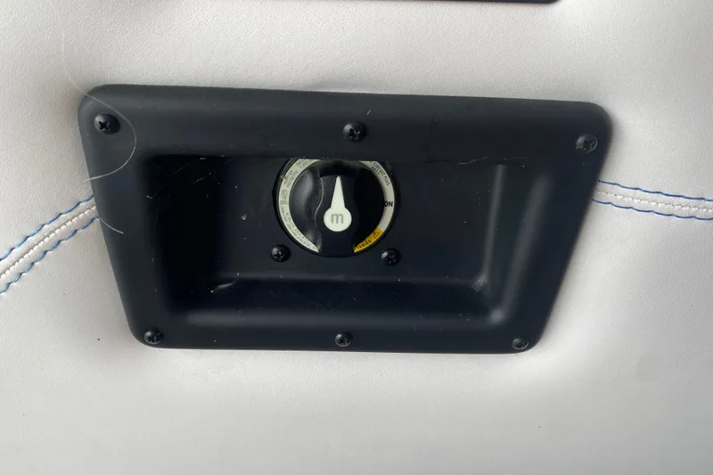 Slide: The Image of Control panel on 2024 Barletta Corsa 25U boat with black frame and white stitching. - 29