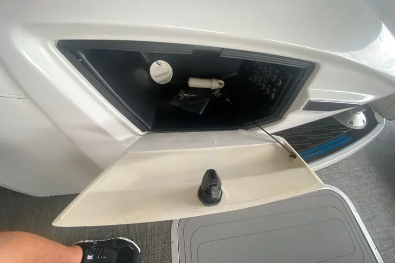 Slide: The Image of 2024 Barletta Corsa 25U storage compartment with open hatch and visible interior components. - 41