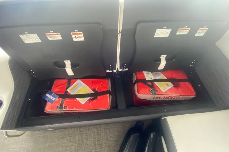Slide: The Image of Storage compartment with life jackets on a 2024 Barletta Corsa 25U boat. - 34