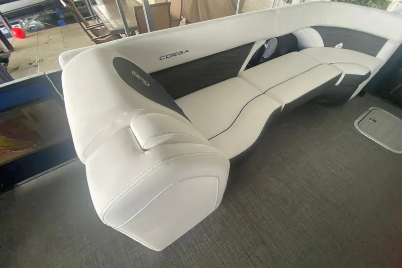 Slide: The Image of 2024 Barletta Corsa 25U boat interior with sleek white seating and modern design. - 38