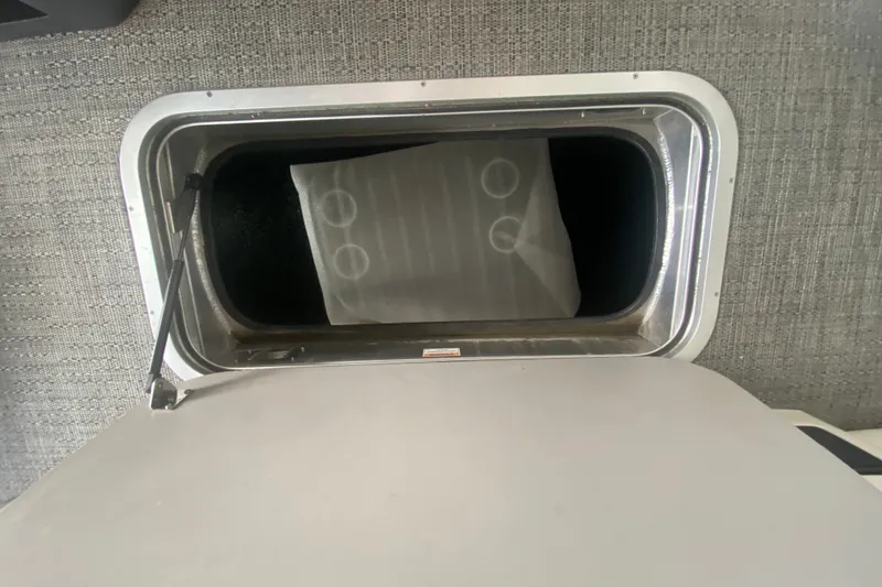 Slide: The Image of Storage compartment in 2024 Barletta Corsa 25U boat, featuring a sleek interior design. - 42