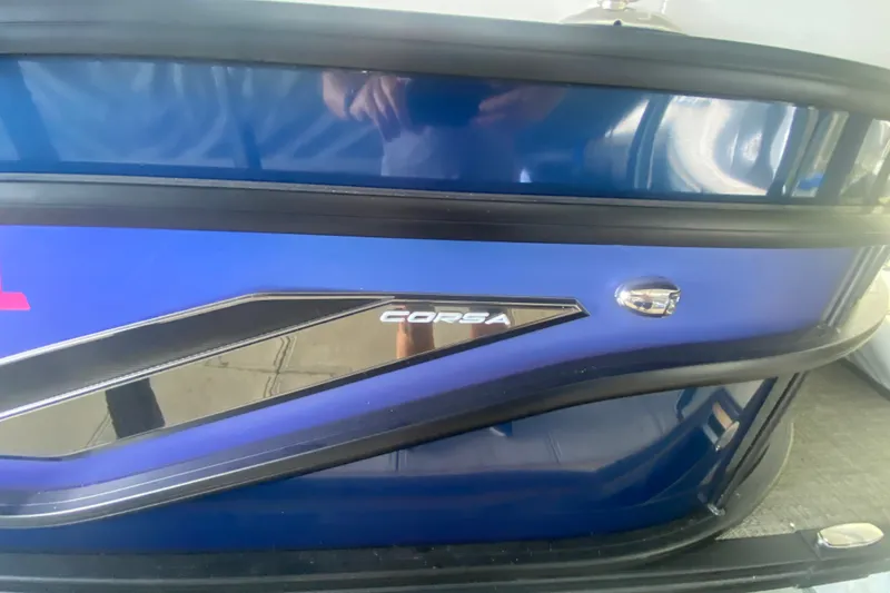 Slide: The Image of 2024 Barletta Corsa 25U boat, blue exterior with sleek design details. - 33