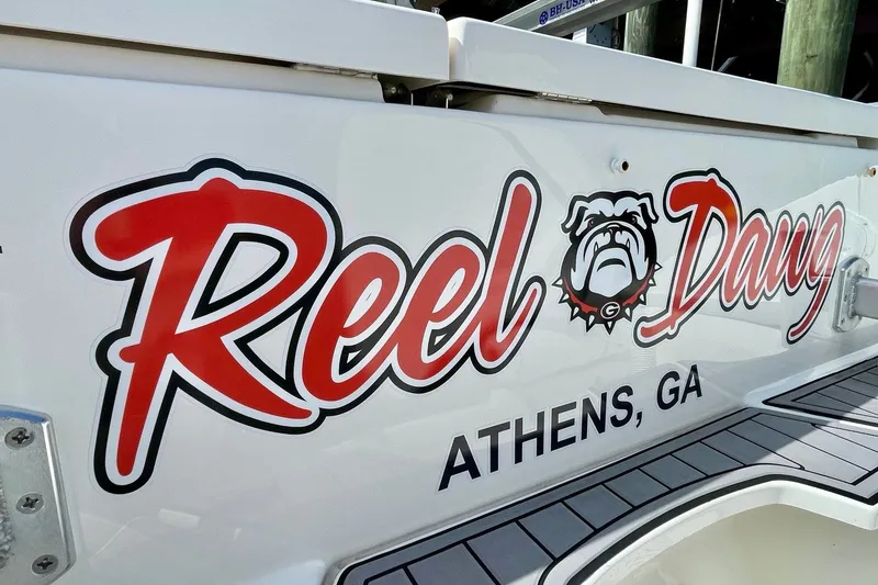 Slide: The Image of 2022 Pursuit OS 355 Offshore boat with "Reel Dawg" logo, Athens, GA. - 9