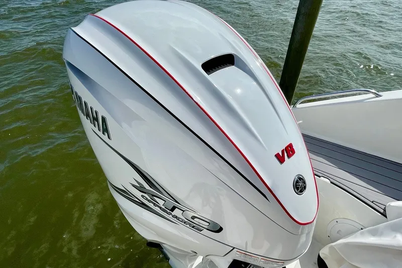 Slide: The Image of Yamaha V8 outboard engine on 2022 Pursuit OS 355 Offshore boat, docked on water. - 11