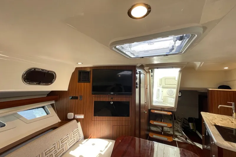 Slide: The Image of Interior of 2022 Pursuit OS 355 Offshore boat, featuring modern design and amenities. - 36