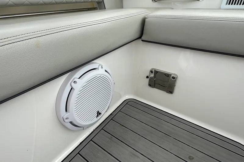 Slide: The Image of Interior of 2022 Pursuit OS 355 Offshore boat with speaker and cushioned seating. - 23