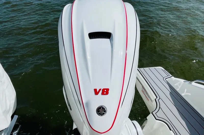 Slide: The Image of 2022 Pursuit OS 355 Offshore boat with V8 engine on water. - 10