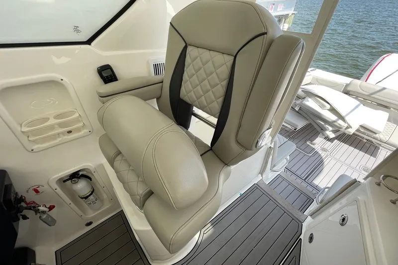 Slide: The Image of Luxurious seating on 2022 Pursuit OS 355 Offshore boat, featuring elegant design and premium materials. - 25