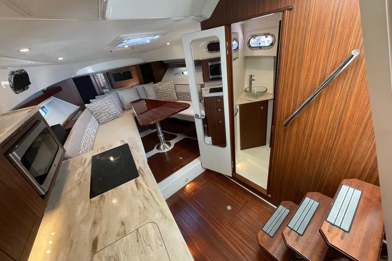 Slide: The Image of Luxurious interior of 2022 Pursuit OS 355 Offshore boat with modern amenities. - 30