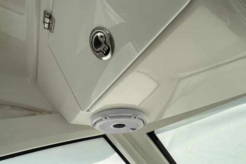Slide: The Image of 2022 Pursuit OS 355 Offshore cabin interior with speaker and hatch detail. - 22