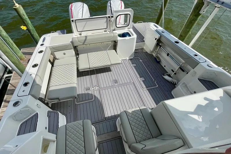 Slide: The Image of 2022 Pursuit OS 355 Offshore boat interior with spacious seating and modern design. - 15