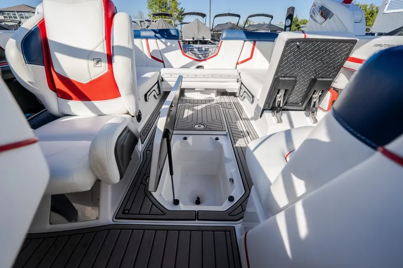 Slide: The Image of Interior of 2016 Nautique Super Air Nautique G23 boat with stylish seating and storage. - 29
