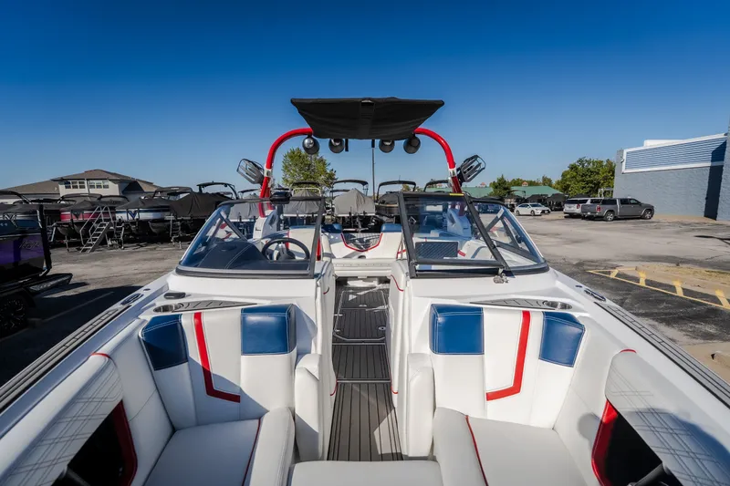 Slide: The Image of 2016 Nautique Super Air Nautique G23 boat interior with red, white, and blue seating. - 27