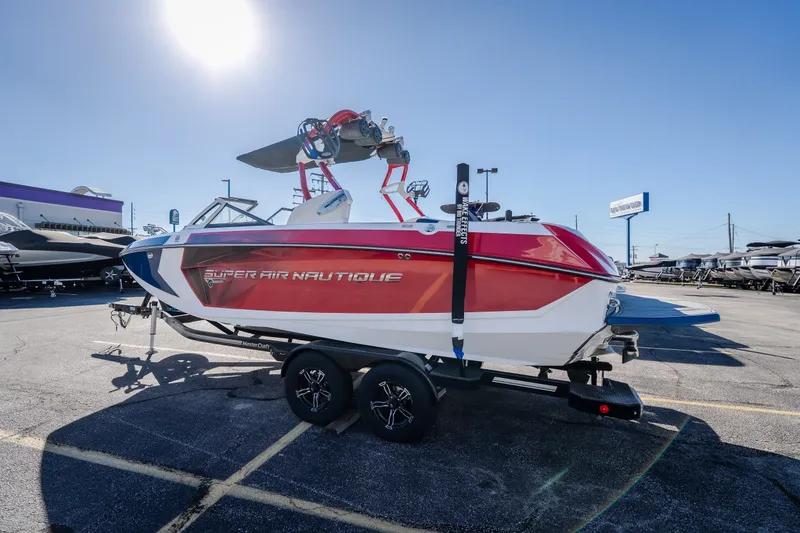 Slide: The Image of 2016 Nautique Super Air Nautique G23 boat on trailer in sunny dealership lot. - 41