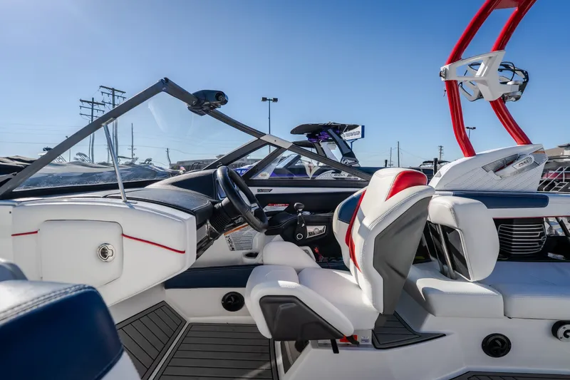 Slide: The Image of 2016 Nautique Super Air Nautique G23 boat interior with sleek design and modern controls. - 16