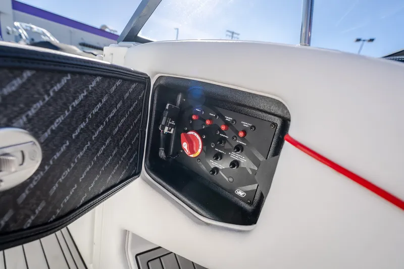 Slide: The Image of Control panel of a 2016 Nautique Super Air Nautique G23 boat, featuring switches and dials. - 20