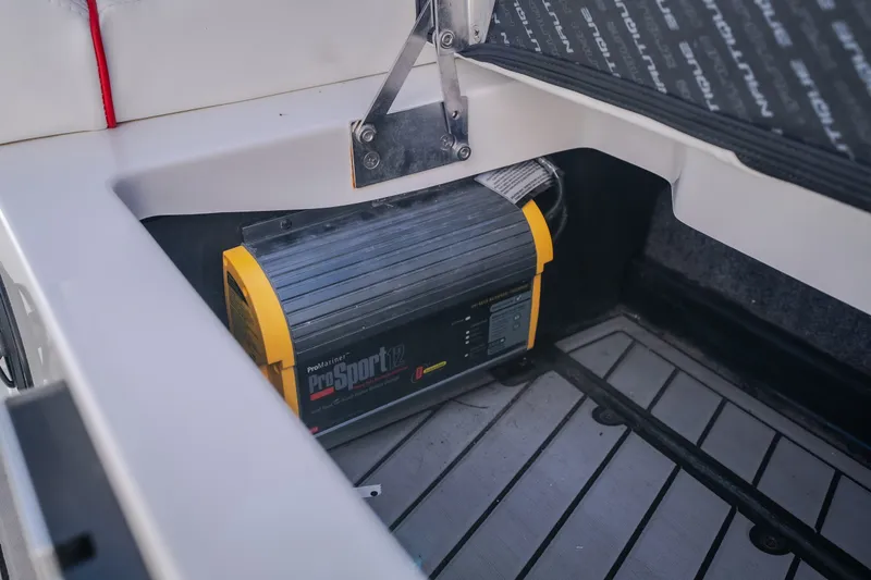 Slide: The Image of Battery charger in 2016 Nautique Super Air Nautique G23 boat compartment. - 37