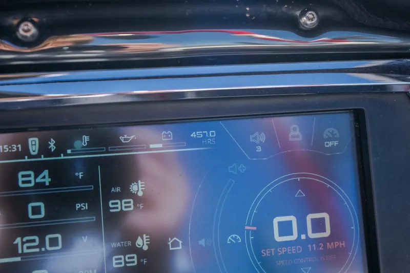 Slide: The Image of Dashboard of 2016 Nautique Super Air Nautique G23 showing speed and temperature readings. - 40