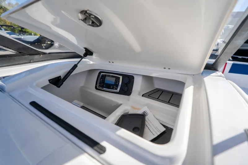 Slide: The Image of Open storage compartment in 2016 Nautique Super Air Nautique G23 boat. - 19