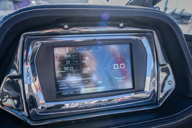 Slide: The Image of 2016 Nautique Super Air Nautique G23 dashboard display with digital controls and gauges. - 39