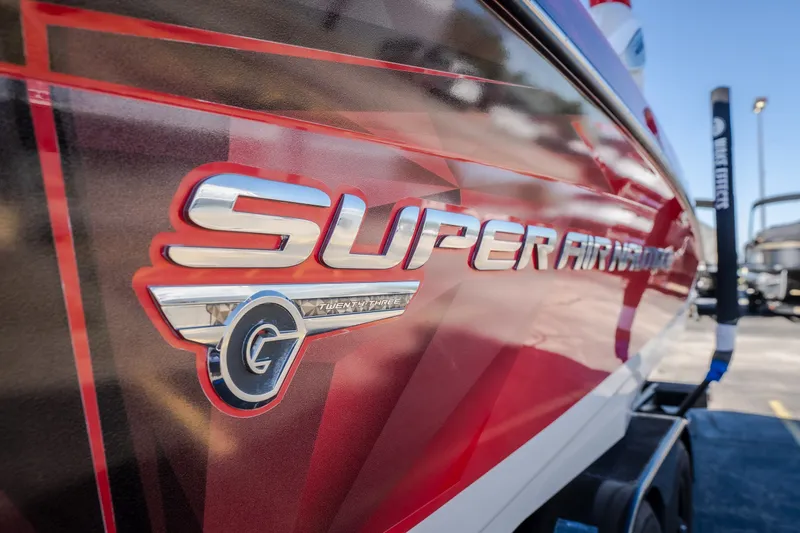 Slide: The Image of 2016 Nautique Super Air Nautique G23 boat with red and silver detailing. - 42