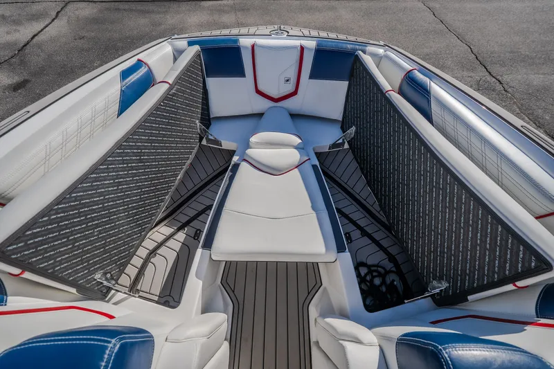 Slide: The Image of Interior of 2016 Nautique Super Air Nautique G23 boat with spacious seating and storage. - 25