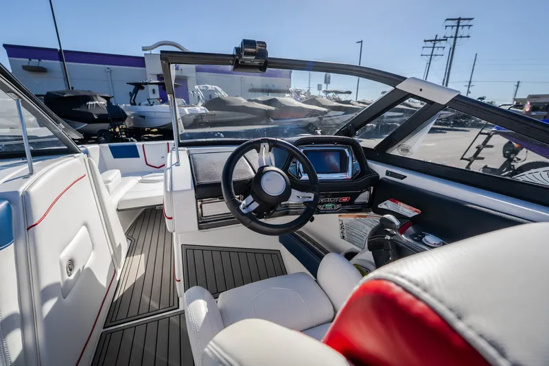 Slide: The Image of Interior view of 2016 Nautique Super Air Nautique G23 boat cockpit. - 15