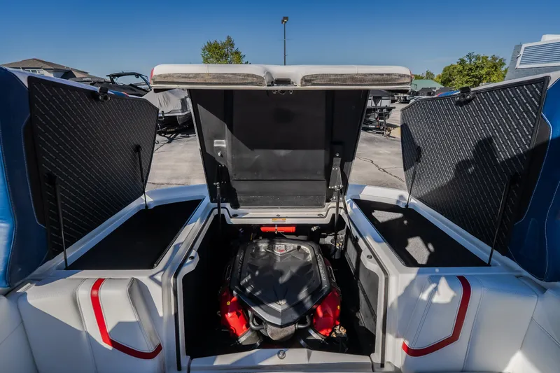 Slide: The Image of 2016 Nautique Super Air Nautique G23 engine compartment with open hatches, showcasing powerful engine. - 33
