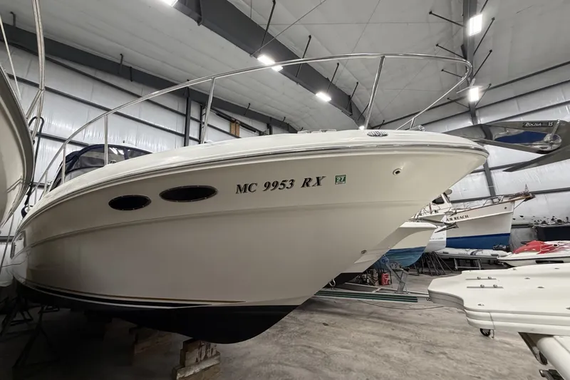 The Image of 1999 Sea Ray 340 Sundancer boat in indoor storage facility. - 0