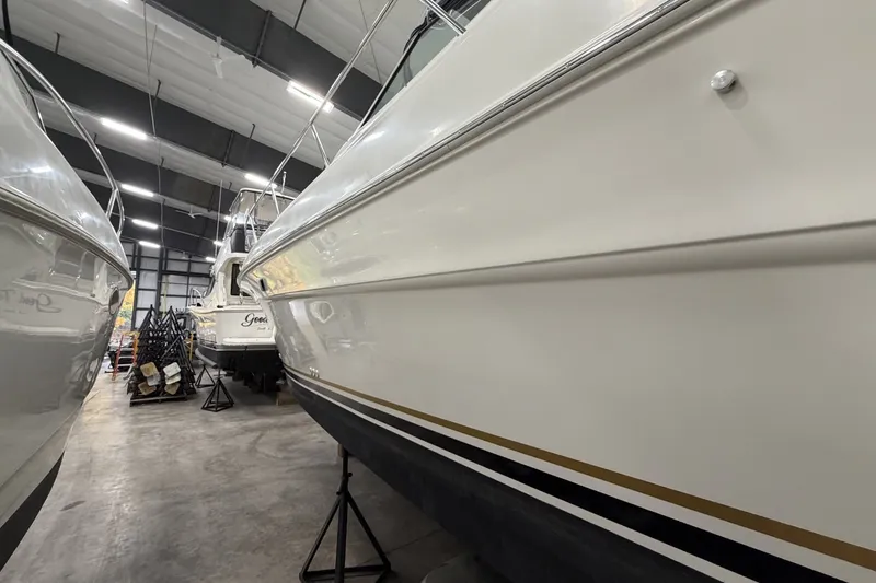 Slide: The Image of 1999 Sea Ray 340 Sundancer yacht in indoor storage, side view. - 7