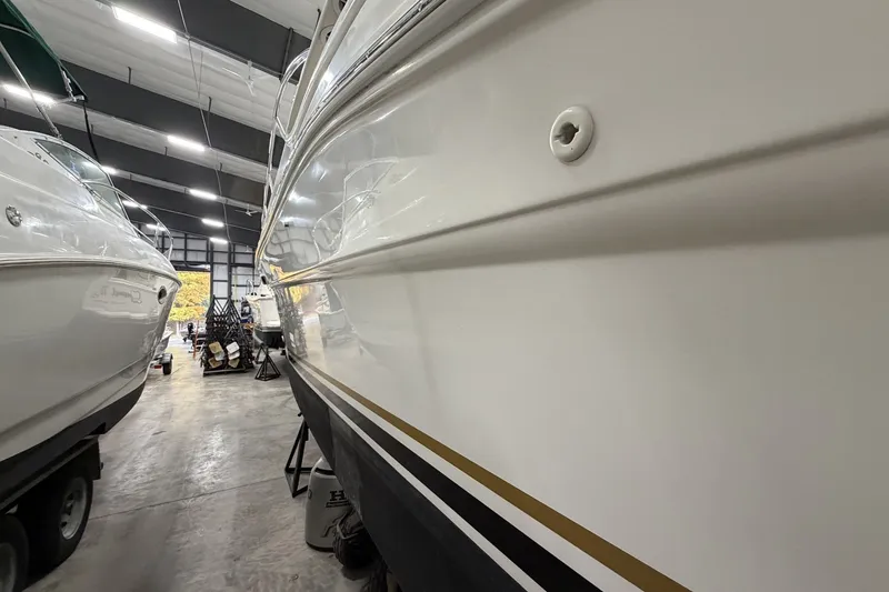Slide: The Image of 1999 Sea Ray 340 Sundancer in a boat storage facility, side view. - 8