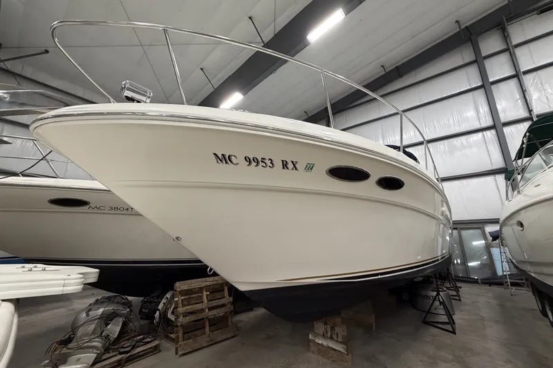 Slide: The Image of 1999 Sea Ray 340 Sundancer boat in indoor storage facility. - 3