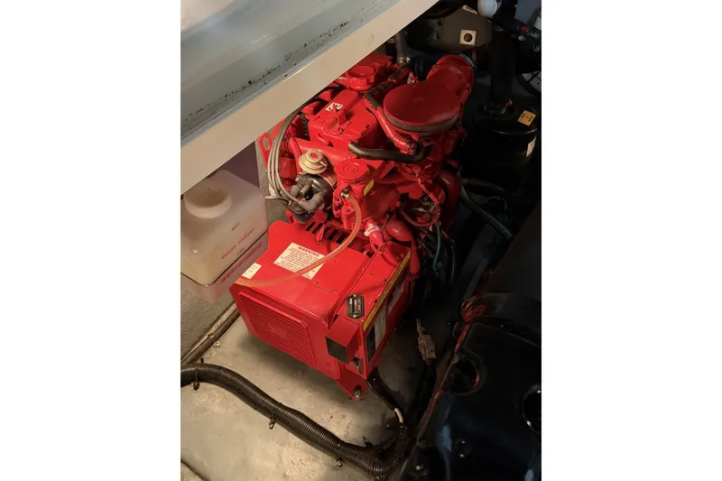 Slide: The Image of Red engine inside 1999 Sea Ray 340 Sundancer boat, detailed view. - 42
