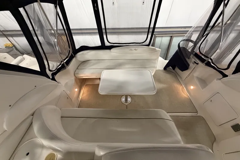 Slide: The Image of Interior of 1999 Sea Ray 340 Sundancer boat with seating and table. - 15